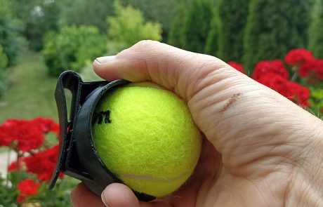 gripping the tennis court holder with wings